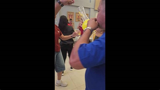 Office colleagues play hilarious 'pass the balloon' Christmas game