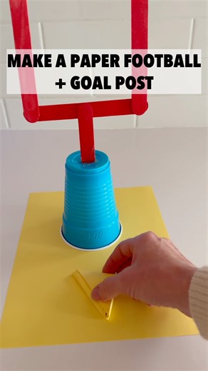 Score BIG with easy Super Bowl entertainment for kids 🏈 Watch how we make our paper football DIY goal post with a cup & craft sticks — perfect for game day fun before kickoff! 🙌 Full instructions on the blog . #football #stemeducation #diy #craftsforkids #superbowl #kidsactivities #teachbesideme | Teach Beside Me