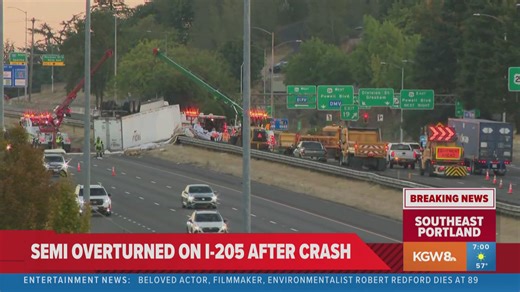 Crews working to clear overturned semi-truck off I-205