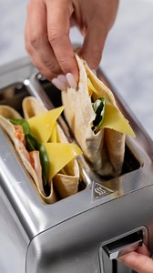 Transform your wrap into a cheesy toastie masterpiece with this toaster hack. Crispy, melty perfection in minutes! ✨ Don’t forget to add lots of our Tasty Natural Slices for extra goodness! Exclusive to Woolworths. | Dairyworks