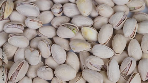 Detailed macro image of salted pistachios in shells for advertising. Highquality macro shot showcasing salted pistachios with shells and green kernels for branding and packaging
