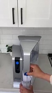 The AquaTru Sliding Tray is a must-have! Designed for AquaTru countertop purifiers, this space-saving sliding tray makes it easy to move your purifier. With a simple press of a button, you can slide your AquaTru forward to access your tap water tank or to fill bottles and pitchers. | AquaTru Water