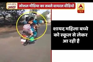 9M views · 70K reactions | Viral Sach: Boy does homework while riding on a scooty, video goes viral | ABP Live | Facebook