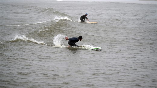 Surfers forego the dangers of the ocean in Manasquan