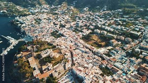 Aeolian Islands. Lipari town aerial view with drone overlooking to other islands: Hovering on Lipari city centre, Lipari's castle and Canneto's beach