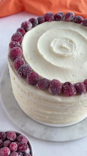 ✨NEW RECIPE✨ Cranberry orange cake! Made with moist ane fluffy orange cake layers, cranberries, and orange cream cheese frosting! Recipe linked in my profile or head to cakemehometonight.com! #cranberryorange #cake #christmascake #christmasdessert #holidaybaking