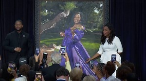 Award-winning host and producer Oprah Winfrey unveiled her portrait painted by Chicago-based artist Shawn Michael Warren at the National Portrait Gallery. | USA TODAY