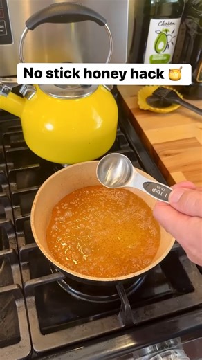 Add a splash of olive oil to measuring spoon before pouring in honey #honey #cookingtips #oliveoil | Liz & Jeff