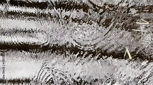 Abstract footage of reflection on water in puddle at rainy weather, reflective surface the water, micro waves, water texture, nobody