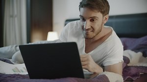 Happy man using laptop computer at home | Free Stock Video Footage