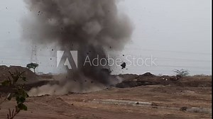Blasting of rocks in a quarry. Crushing boulders using explosive technologies. The archive contains three versions of the explosion filmed from one point at different times of the day. Stock Video