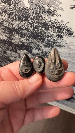Teresa Kiplinger on Instagram: "I decided to try my hand at stone carving today. Whitby Jet is a very soft stone— more like wood, really — in fact, it once was wood, millennia ago, that became fossilized. It was popular in Victorian era mourning jewelry, and I’ve wanted to try to carve it in that same tradition for years. It’s a fascinating, almost alchemical material to carve as it shifts from off white to brown to gunmetal as it is worked and burnished. These carved cabochons are not quite fin