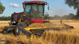 Mike Less - Farmhand Mike -- In this video I visit a farm near Baltimore Ohio as they bale wheat straw after wheat harvest. This farm is baling the straw and picking up the bales. As soon as the field is baled they are immeditalely no till planting double crop soybeans.