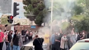 Death of Iranian woman arrested over dress code violation sparks protests