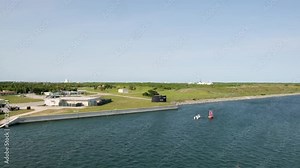 Coastal Services of Poseidon Wharf West and Memorial to original 41 for Freedom fleet ballistic missile submarines. Observation from deck during cruise ship departure from port Canaveral Stock Video