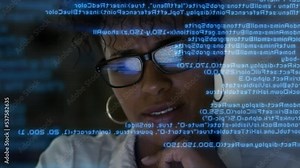 Lateral Dolly Focused Young African American Software Developer or Engineer Working on Computer, Line of Program Code Projected on His Face and Reflecting. Augmented Reality Machine Learning Data Al Stock Video