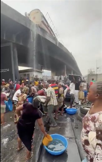 Happening now at Tincan Liverpool Bridge, Apapa: A tanker overturned, with people scooping contents from underneath the bridge. | Channels Television