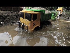 MOBIL TRUCK BAWA PASIR UNTUK PENGECORAN JALAN