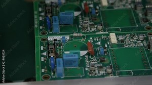 Circuit board manufacturing in a factory close up hands assembling components