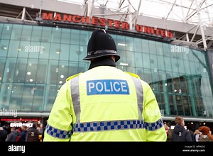 A general view of a police officer outside Old Trafford during the Premier League match at Old Trafford, Manchester. PRESS ASSOCIATION Photo. Picture date: Saturday December 31, 2016. See PA story SOCCER Man Utd. Photo credit should read: Martin Rickett/PA Wire. RESTRICTIONS: EDITORIAL USE ONLY No use with unauthorised audio, video, data, fixture lists, club/league logos or "live" services. Online in-match use limited to 75 images, no video emulation. No use in betting, games or single club/leag