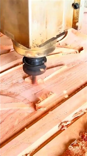 CNC machine routing and engraving complex patterns on a wood surface with high precision carving