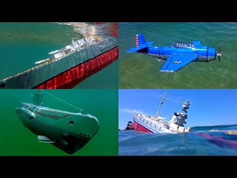 Cardboard ship sinking, battle between models of a battleship, Uboat and warplane, submarine sinking