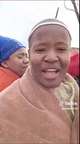 Cultural Gathering in Rural Setting with Traditional Attire