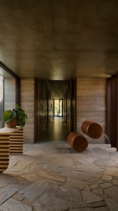 Issue No. 19 Feature • Video Feature • Inside this home built from earth, stone and timber, architecture gently integrates with the surrounding landscape to create a tranquil and grounded retreat in Currumbin Valley. Realised by @hga.architects, with interior curation by @ellisonstudios, Finca Talluca responds to its environment with a cruciform plan that steps gently down toward the creek – a defining presence along the site’s edge. From here, the layout unfolds through carefully calibrated tra