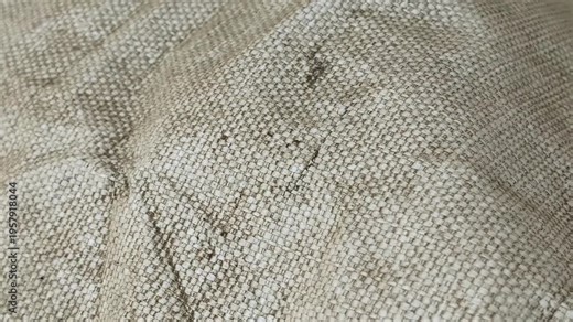 Close-up of woven polypropylene fabric texture. Industrial big bag sack surface with detailed fiber pattern. Synthetic material pan.