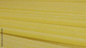 Italian pasta texture close-up macro. Flour products. Macaroni factory and pasta production. Raw spaghetti and noodles