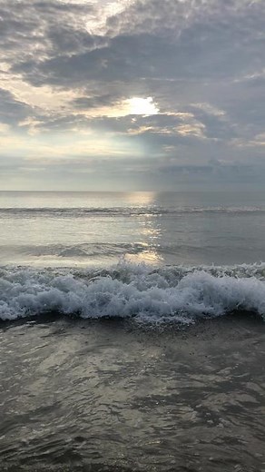 Serene Seascape at Sunrise with Gentle Ocean Waves