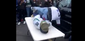 Giants Fan Goes Head-First Into Truck Trying To Break Table With Jets Fan On It (VIDEO)
