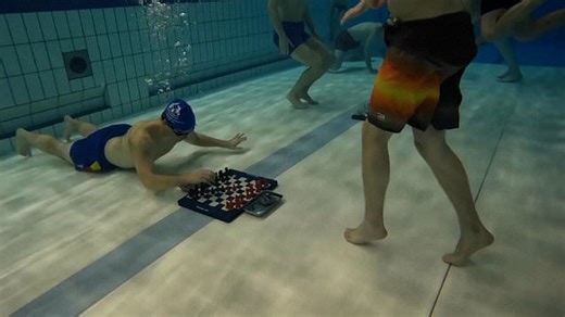Diving chess players battle it out on submerged chess boards