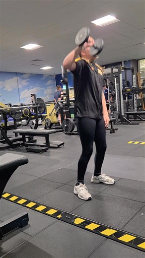 Functional movement training helps you to perform better. The dumbbell alternating snatch has a number of benefits. 1. Body control and co ordination. 2. Core strength - In this movement, maintaining a straight spine prevents thoracic rotation and switches on the core muscles such as the obliques. 3. It is a compound power and strength movement, which means it hits more than one muscle group (Glutes, quads, core, shoulders, back and arms). 4. Its a pulse raiser so can be used as parr of a warm u