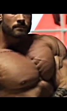 Super muscular, handsome, strong and tall giant bodybuilder and the poses he gives with body(1)