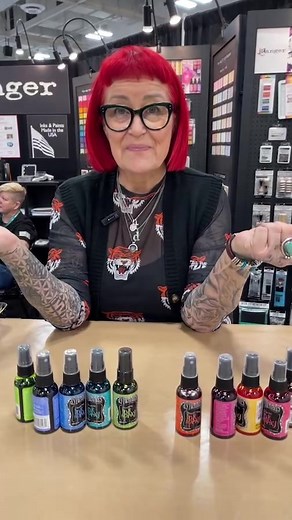 Watch @dyanreaveley create vibrant inky layers with Dylusions Ink Sprays 🎨, adding shimmer ✨ and stamping 📸 on top, live from Creativation by @namtaartmaterialsassociation. dyanreaveley is making inky layers with her Dylusions Ink Sprays and topping it off with some shimmer and stamps Live from Creativation by @namtaartmaterialsassociation. #rangerink #dyanreaveley #dylusionsinksprays #artjournaling | Ranger Ink