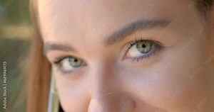 Expressive look of a woman, eyes on the face, painted eyes, hidden flirting. Attracting attention with your gaze.