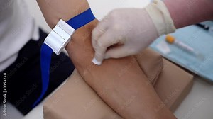 Close-up of the process of taking blood from the vein from man for biochemical blood testing. Preparation for blood test with by phlebotomist technician doctor in medical clinic.