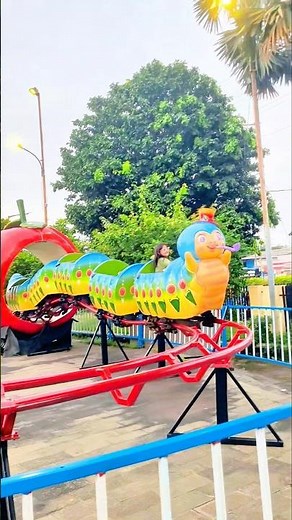 🎢🌈 Brother rides a roller coaster train through the apple tunnel 🍎 #shorts #trending #shortsfeed