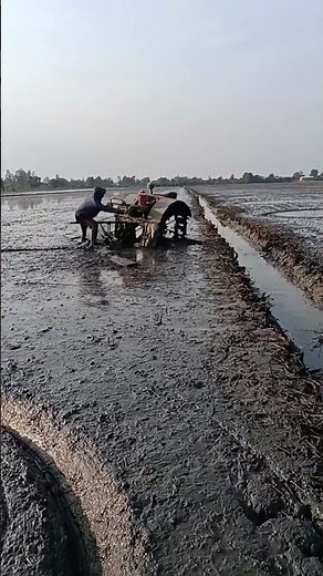 Efficient Muddy Field Plowing with Boat Tractor