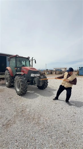 I'M GETTING THE BROKEN TRACTOR STARTED BY TOWING IT