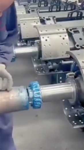 The process of assembling a large machine by a worker