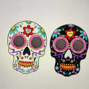 HELP! Which earring design do you guys prefer for my Halloween EarCandy drop? 💀 The black and white sugar skulls with candy detailing? 🍩 Or the scream masks eating Halloween candy?? The final design needs to be submitted in the morning and I’m so torn…. | My Cupcake Addiction