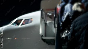 Airplane aircraft service at the night airport. Boarding passenger airliner plane on the airfield