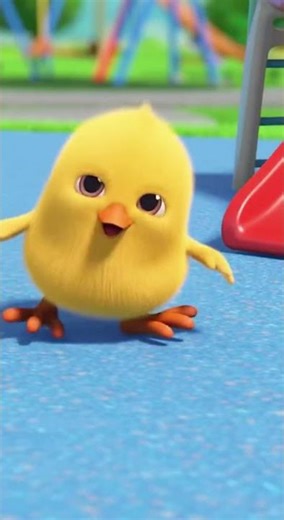 The little chick is playing on the slide