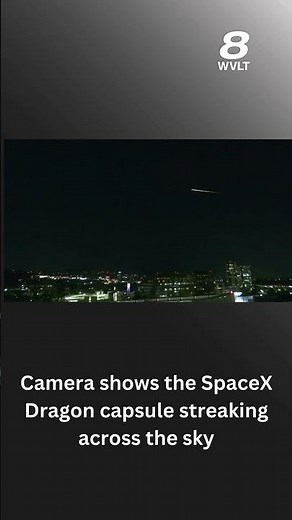 Camera shows the SpaceX Dragon capsule streaking across the sky