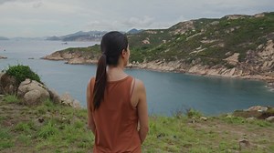 Rear view of a woman enjoying the seascape | Free Stock Video Footage
