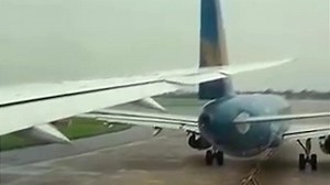 Plane slices through another aircraft's tail in Vietnam airport