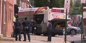16 injured as Baltimore bus crashes into 2 cars, building