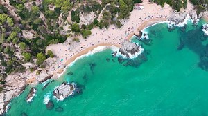 Cala sa Boadella beach in the resort town of Lloret de Mar, Spain. View from a drone, photo from above.